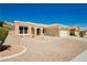 Charming single-story home featuring desert landscaping and a tile roof at 2205 Beacon Ridge Dr, Las Vegas, NV 89134