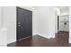Inviting foyer with dark wood floors and freshly painted bright white walls at 2205 Beacon Ridge Dr, Las Vegas, NV 89134