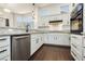 Well-equipped kitchen showcasing granite countertops, white cabinetry, and stainless steel appliances at 2205 Beacon Ridge Dr, Las Vegas, NV 89134