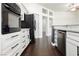 Contemporary kitchen featuring modern appliances, granite countertops, and white cabinetry at 2205 Beacon Ridge Dr, Las Vegas, NV 89134