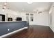 Open-concept kitchen and dining area with a breakfast bar, modern appliances, and dark wood flooring at 2205 Beacon Ridge Dr, Las Vegas, NV 89134