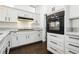Stylish kitchen with stainless steel appliances, granite counters, and ample white cabinetry at 2205 Beacon Ridge Dr, Las Vegas, NV 89134