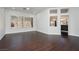 Bright open living room with dark wood floors, and bright white walls at 2205 Beacon Ridge Dr, Las Vegas, NV 89134