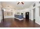 Open-concept living space features a kitchen with white cabinetry and dark appliances at 2205 Beacon Ridge Dr, Las Vegas, NV 89134