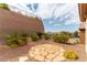Backyard with desert landscaping, stone pathway and mountain views at 2357 Aztec Ruin Way, Henderson, NV 89044