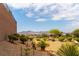 Expansive backyard featuring desert landscaping with mountain views at 2357 Aztec Ruin Way, Henderson, NV 89044
