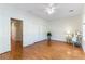 Primary bedroom with hardwood floors, white ceiling fan, and natural light at 2357 Aztec Ruin Way, Henderson, NV 89044