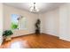Bright dining room with hardwood floors and natural lighting from large window at 2357 Aztec Ruin Way, Henderson, NV 89044