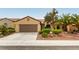 Charming single-story home with desert landscaping, a tile roof and a two-car garage at 2357 Aztec Ruin Way, Henderson, NV 89044