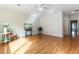 Bright living room with hardwood floors, white ceiling fan, and neutral paint at 2357 Aztec Ruin Way, Henderson, NV 89044