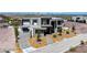 Aerial view of a modern home with mature trees, a three-car garage, and unique landscaping at 25 Rockstream Dr, Henderson, NV 89012