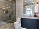 Modern bathroom featuring a glass enclosed shower, sleek vanity, and contemporary fixtures at 25 Rockstream Dr, Henderson, NV 89012