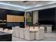 Modern dining room with large table, stylish light fixture and outdoor view at 25 Rockstream Dr, Henderson, NV 89012