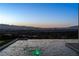 Stunning infinity pool with captivating city views at twilight at 25 Rockstream Dr, Henderson, NV 89012