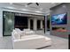 Bright living room with comfortable seating, fireplace, large glass doors, and city views at 25 Rockstream Dr, Henderson, NV 89012