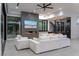 Modern living room featuring a fireplace, bar area, and floor-to-ceiling windows at 25 Rockstream Dr, Henderson, NV 89012