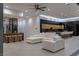 Spacious living room features a wet bar, modern kitchen, and comfortable white sofa at 25 Rockstream Dr, Henderson, NV 89012
