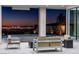 Outdoor patio with modern furniture, offering a serene space with city skyline views at 25 Rockstream Dr, Henderson, NV 89012