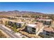 Overhead view of the community with mountain views, showcasing the residential buildings, landscaping, and road layout at 2555 Hampton Rd # 2308, Henderson, NV 89052