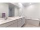Modern bathroom with double sinks, a large mirror, and a soaking tub for relaxation at 2555 Hampton Rd # 2308, Henderson, NV 89052