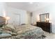 Comfortable bedroom featuring a queen-sized bed, dark wood dresser, and neutral-toned walls at 2555 Hampton Rd # 2308, Henderson, NV 89052
