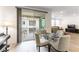 Bright dining area with access to a private balcony with views of the community at 2555 Hampton Rd # 2308, Henderson, NV 89052