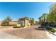 Community entrance featuring a guardhouse and lush landscaping, providing security and curb appeal at 2555 Hampton Rd # 2308, Henderson, NV 89052