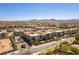 Scenic view of a residential community with well-maintained buildings, trees, and desert landscaping at 2555 Hampton Rd # 2308, Henderson, NV 89052