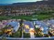 Expansive aerial shot showcasing the property's beautiful backyard pool, lush landscaping, and golf course community at 2571 Red Springs Dr, Las Vegas, NV 89135