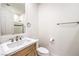 Bathroom featuring a new vanity with light countertop, mirror, and tiled shower at 2571 Red Springs Dr, Las Vegas, NV 89135