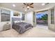 Bedroom featuring large bed, balcony access, and ample natural light at 2571 Red Springs Dr, Las Vegas, NV 89135