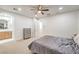 Light-filled bedroom featuring a ceiling fan, carpet floors and an ensuite bathroom at 2571 Red Springs Dr, Las Vegas, NV 89135