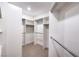 A spacious walk-in closet offers ample storage with built-in shelving and metal hanging rods at 2571 Red Springs Dr, Las Vegas, NV 89135