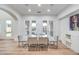 Elegant dining room with modern furnishings and views of the pool area at 2571 Red Springs Dr, Las Vegas, NV 89135