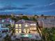 Elegant two-story home with stucco exterior, arched entryways, a balcony, and a private backyard pool and spa at 2571 Red Springs Dr, Las Vegas, NV 89135