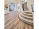 Spacious foyer featuring wood floors, a curved staircase, and elegant design at 2571 Red Springs Dr, Las Vegas, NV 89135