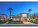 Charming home featuring a well-manicured lawn, mature landscaping, and a two-car garage at 2571 Red Springs Dr, Las Vegas, NV 89135