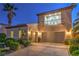 Beautiful home exterior with manicured landscaping and a spacious three-car garage at 2571 Red Springs Dr, Las Vegas, NV 89135