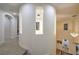 Bright curved hallway features open windows to the level below and neutral carpet flooring at 2571 Red Springs Dr, Las Vegas, NV 89135