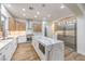 Modern kitchen features large marble island, stainless steel appliances, and wood cabinets at 2571 Red Springs Dr, Las Vegas, NV 89135