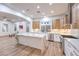 Modern kitchen features a large island, stainless steel appliances, and hardwood floors at 2571 Red Springs Dr, Las Vegas, NV 89135