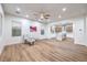 Open-concept living room features hardwood floors and a modern kitchen with an island at 2571 Red Springs Dr, Las Vegas, NV 89135