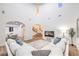 Bright living room with high ceilings, wood floors, comfortable seating, and an open floor plan at 2571 Red Springs Dr, Las Vegas, NV 89135