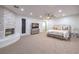 Open main bedroom with carpet floor features a fireplace, a ceiling fan, and a mounted television at 2571 Red Springs Dr, Las Vegas, NV 89135