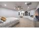 Spacious main bedroom features a modern fireplace, accent chair, recessed lighting and a ceiling fan at 2571 Red Springs Dr, Las Vegas, NV 89135