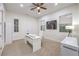 Bright office features a ceiling fan, a large desk, and ample storage space at 2571 Red Springs Dr, Las Vegas, NV 89135