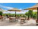 Relaxing outdoor patio offers shade umbrellas and picturesque views, perfect for enjoying casual conversation and dining at 2571 Red Springs Dr, Las Vegas, NV 89135