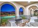 Charming covered patio with a view of the pool, landscape and mountains at 2571 Red Springs Dr, Las Vegas, NV 89135