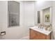 Modern powder room with a window and stylish wooden vanity at 2571 Red Springs Dr, Las Vegas, NV 89135
