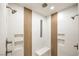 Modern shower with dual shower heads, stylish tile accents, and integrated shelving for convenience at 2571 Red Springs Dr, Las Vegas, NV 89135